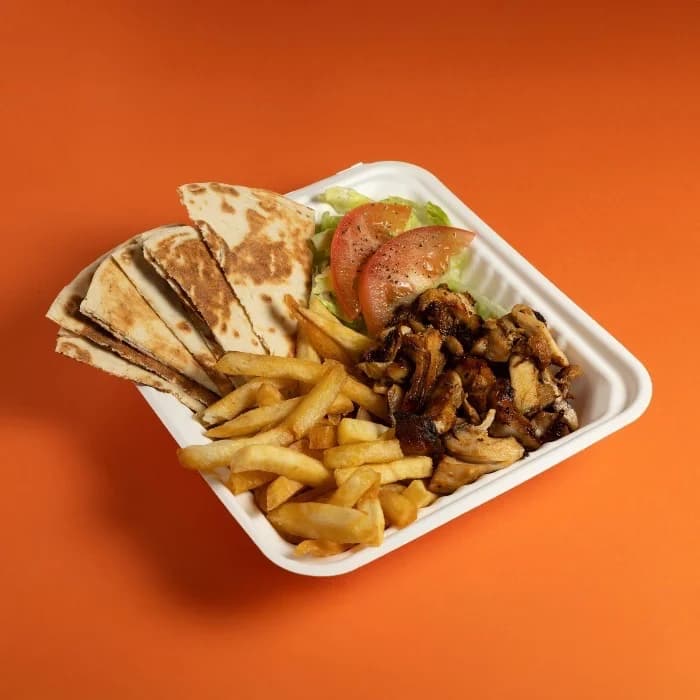 Kebab plate with chips and pita